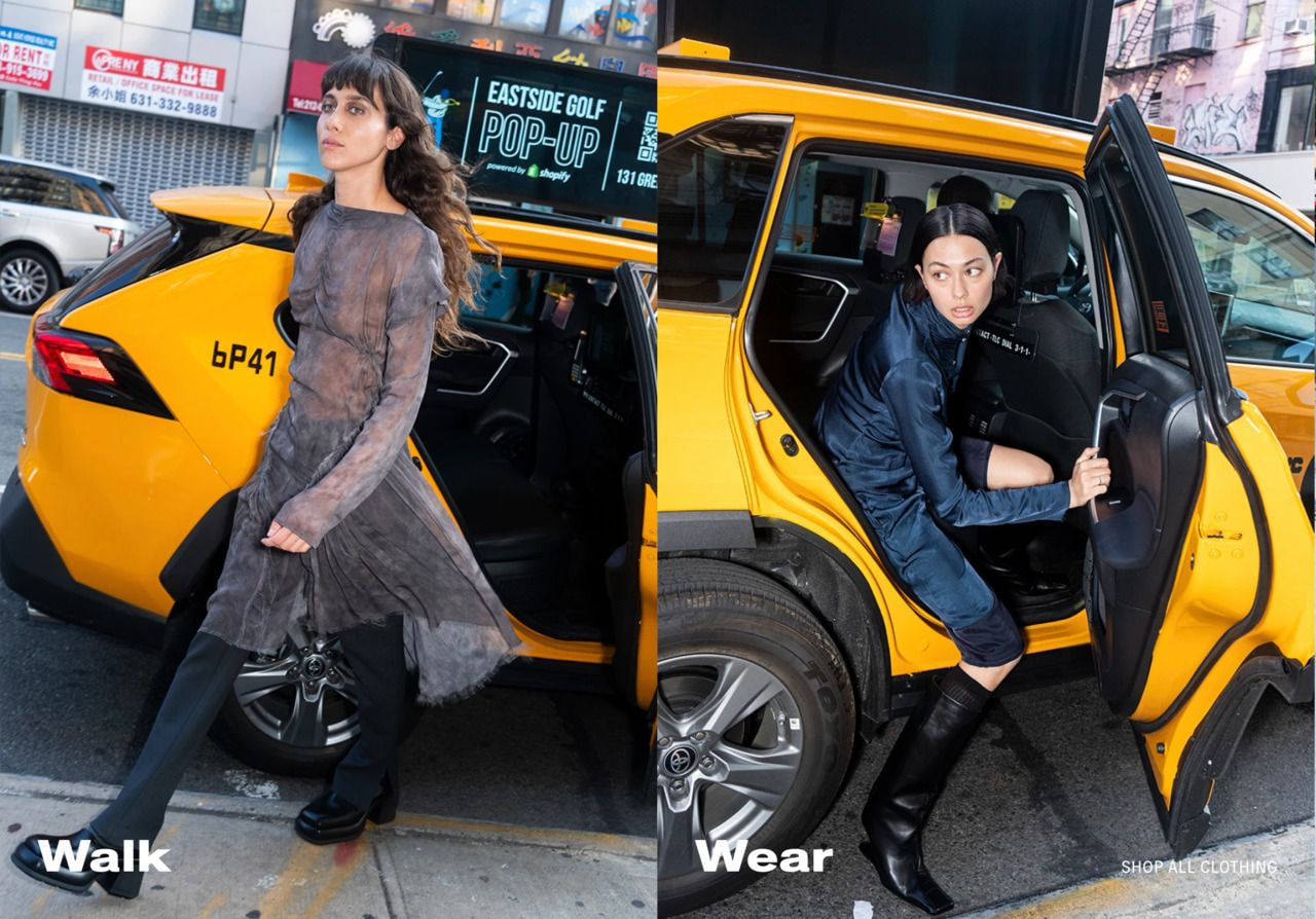 two women getting out of a yellow taxi